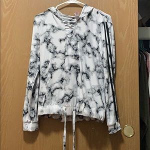 A long sleeve top with a hoodie